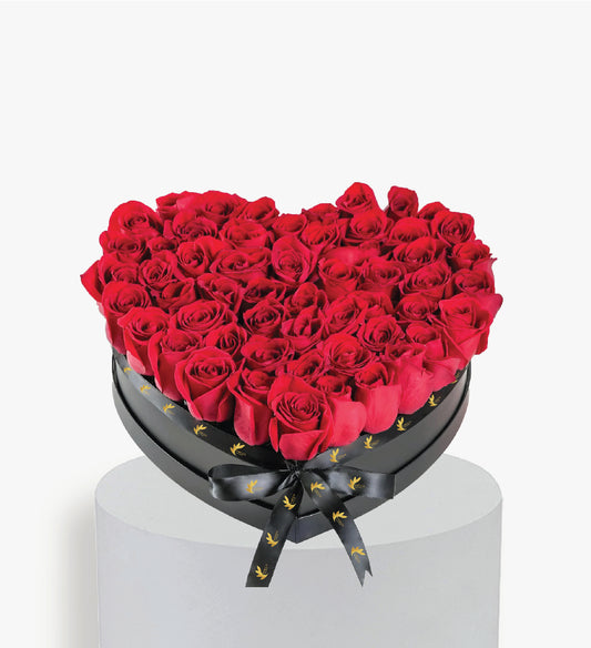 Red Roses in large Heart Box .